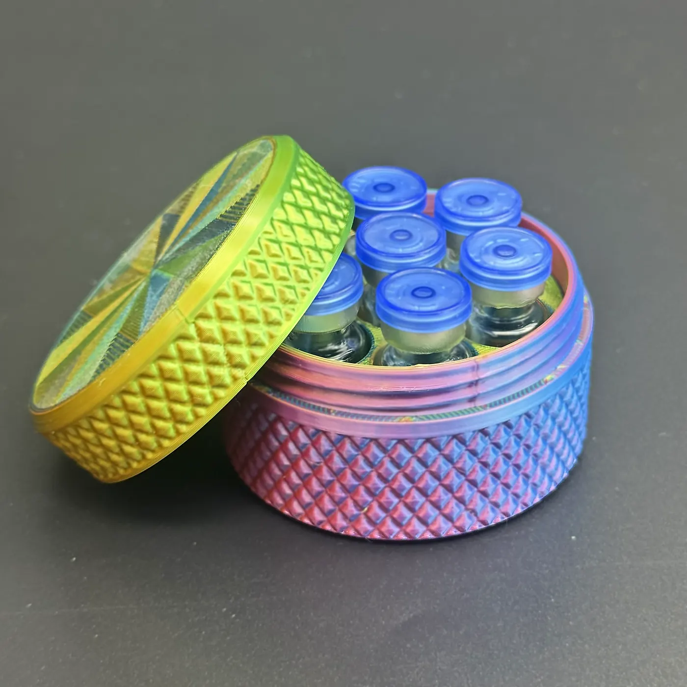 cylindrical vial case opened next to 3ml vials ready to load